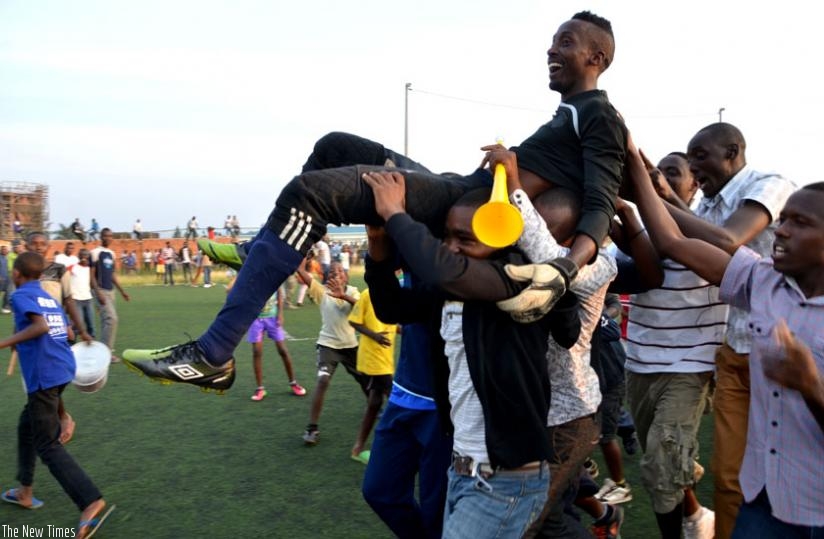 Mvuyekure is carried shoulder-high by Police fans after scoring the winning penalty against Kiyovu yesterday at FERWAFA grounds. (Samuel Ngendahimana)