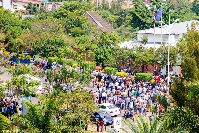 People gather at the gates of British high commission in Kigali protesting against the recent arrest of Lt Gen Karenzi Karake. (Doreen Umutesi)