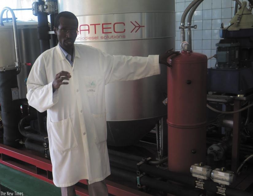 Eng. Theoneste Ishimwe, the former head of IRST Kigali research station at Mulindi, explains the production process in this 2014. (photo)
