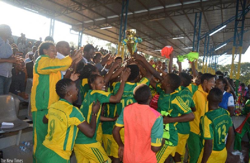 AS Kigali celebrate with Mayor Fidele Ndayisaba at Kicukiro stadium on Tuesday. (Courtsey)