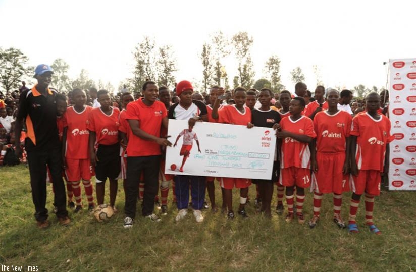 Abarashi Girls team pose with trophy and a Rwf100.000 chaque last sunday in Gatsibo. (Courtsey)