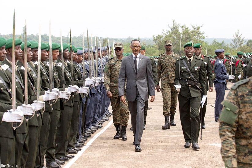 President Kagame inspects a guard of honour mounted by the new officer cadets at their graduation yesterday. (Village Urugwiro)