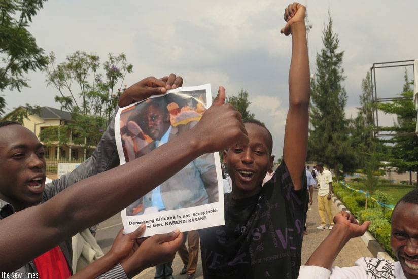 Youth in Nyanza, Southern Province demonstrate on Thursday, as they hold a picture of General Karake who was arrested in the UK. (Emmanuel Ntirenganya)