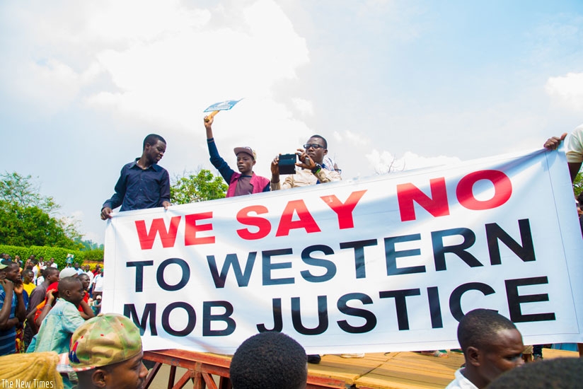 Protesters during a sit-in near the UK High Commission in Kacyiru, Kigali last week. (Doreen Umutesi)