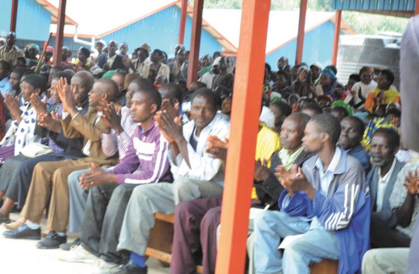 Ruvune residents  cheer. (Theogene Nsengimana)