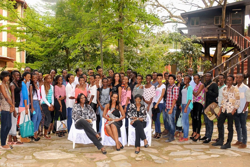 Across section of models who will take part in Kigali Fashion Week 2015 pose for a group photo with the judges.