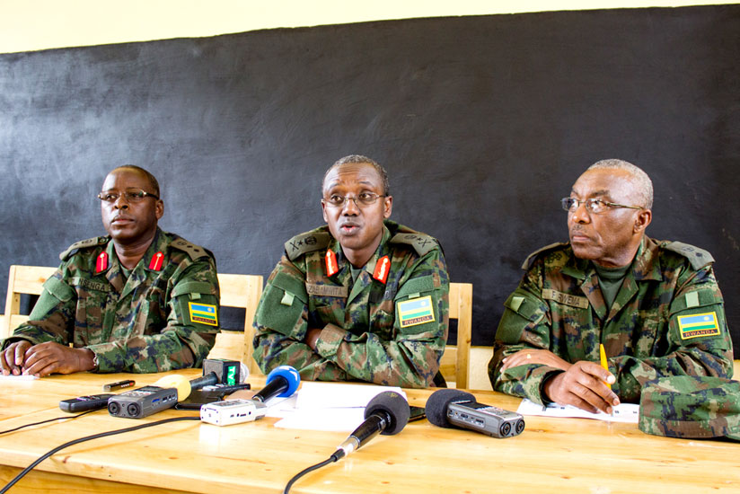 L-R; Col Dr Zac Nsenga (L), Gen Nzabamwita and Lt Col Dr Frank Rwema brief journalists in a classroom at Gishambashayo Primary School.