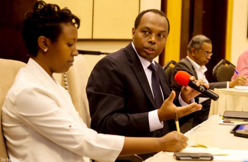 RDB chief executive Francis Gatare responds to questions regarding the new investement code yesterday. Left is Sandra Rwamushaija, the RDB acting chief operations officer. (Doreen Umutesi)