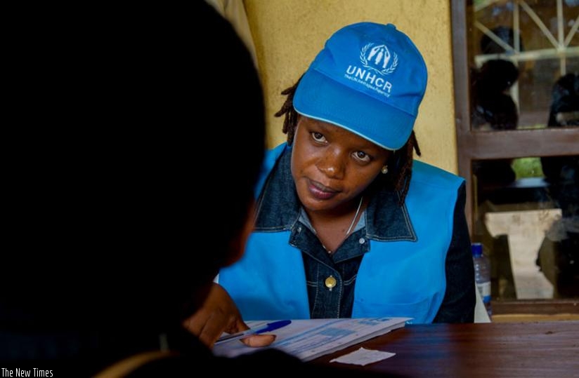 A UNHCR official registers a refugee at Red Cross offices in Kigali yesterday. (D. Umutesi)