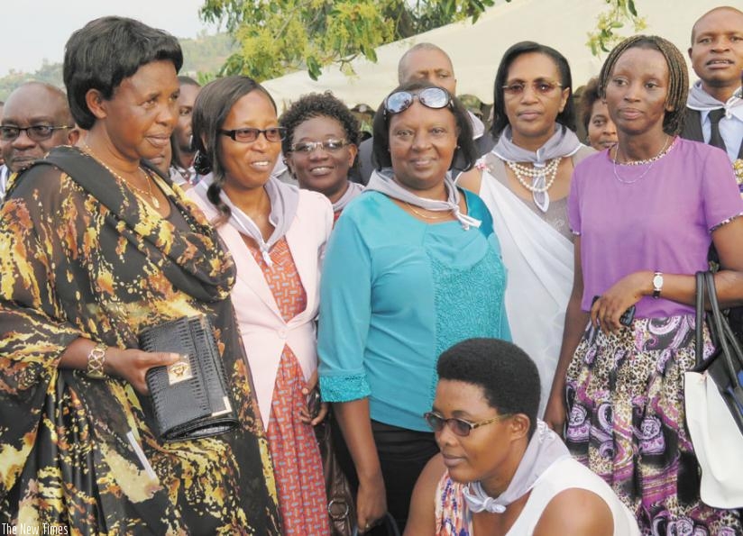 Nyiraneza (L) is pictured with some members of the parliament delegation and some people she saved. This was at the event to recognise her held in Huye Sector, Huye District on Tuesday.  (Emmanuel Ntirenganya)