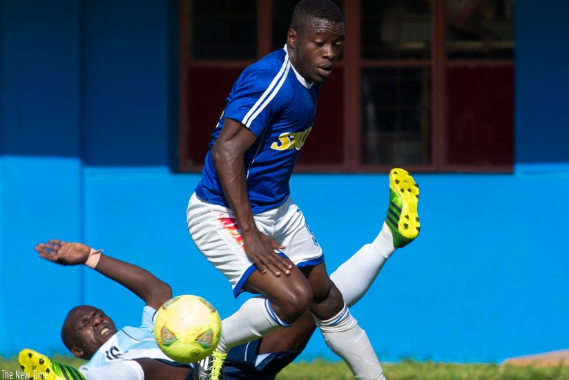 Rayon Sports striker Peter Otema is challenged by Police's Fabrice Twagizimana during a previous enounter. The two teams meet in the Peace Cup final today. (File)