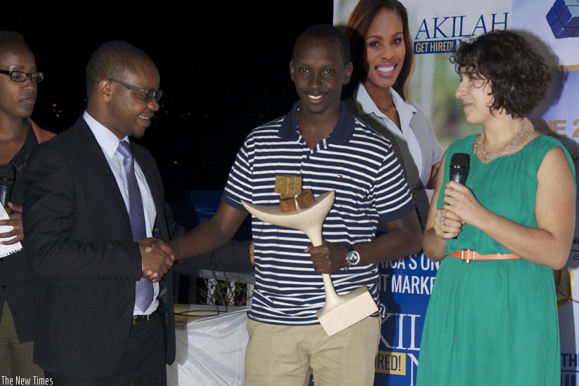 Patrick Buchana receives an award. (Moses Opobo)