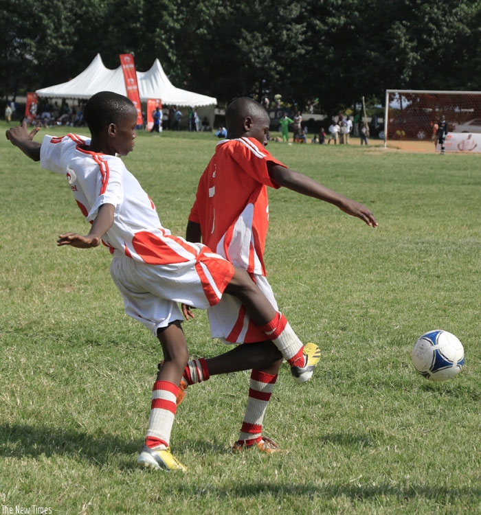 Jean Luc Niyifasha (right) scored the second goal for Inyange Academy in the finals against hosts Juatoto. (R. Bishumba)