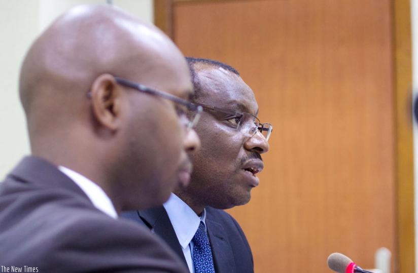 Yusuf Murangwa, the director general of the National Institute of Statistics of Rwanda (L) together with Minister Gatete address the media at a past press conference last month. (Timothy Kisambira)