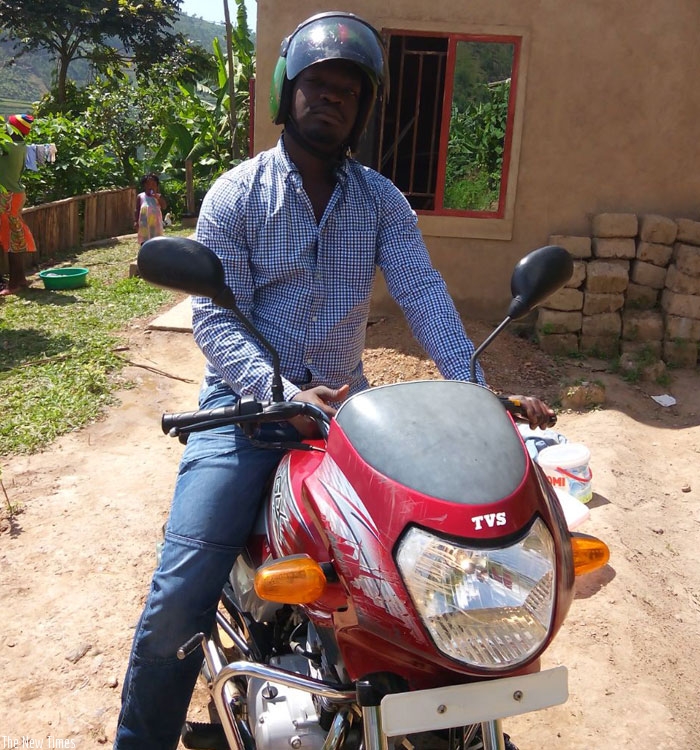 Mpungirehe gets ready to hit the road as a taxi-moto cyclist. (Joseph Oindo)