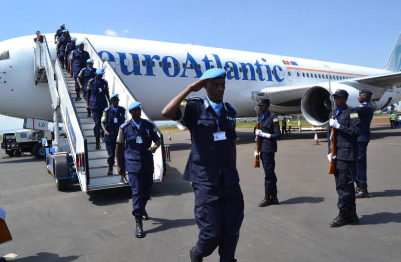 CP Bruce Munyambo, the contingent commander of RWAFPU V salutes as he led his contingent on arrival at Kigali International Airport. (Courtesy) 