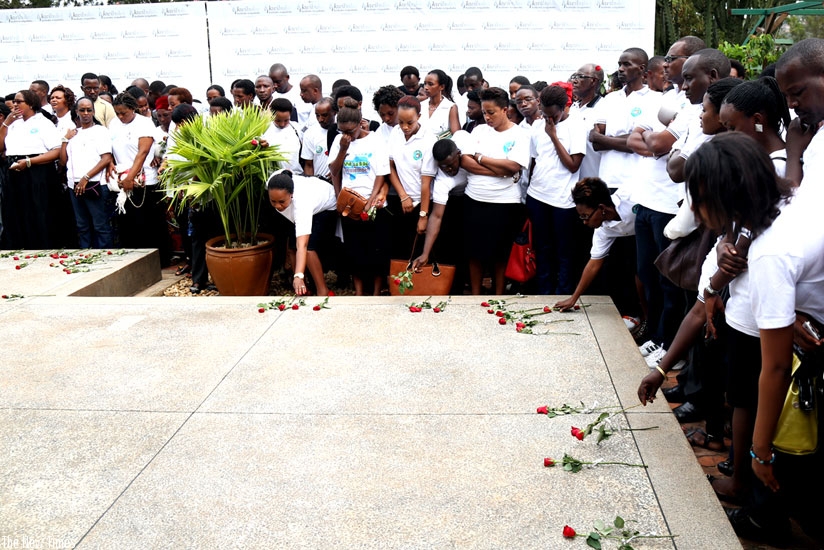 Mourners lay roses on a mass grave at Kigali Genocide Memorial in honour of the victims of the Genocide. (File)