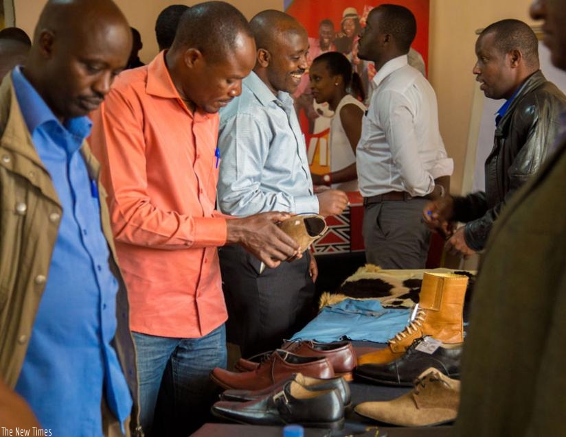 An exhibitor displays his leather products during an SMEs exhibition in Kigali last month. (File)