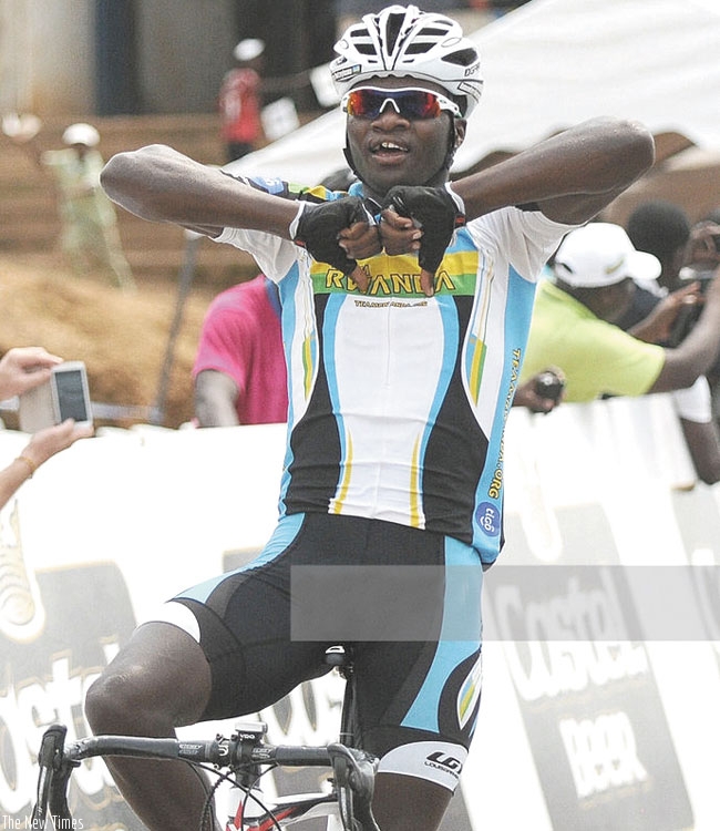Uwizeyimana celebrates as he crosses the finish line to win stage 5 of La Tropicale Amissa Bongo 2014. (Courtesy)