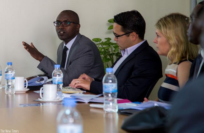 Jonathan Gatera, the director-general of financial stability at BNR, comments on Rwanda's economic status at the WB offices in Kigali yesterday. (Doreen Umutesi)