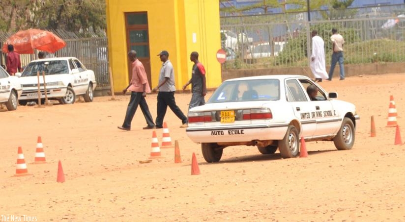 Students learn how to drive outside Amahoro stadium in Remera, Gasabo District. (Timothy Kisambira)