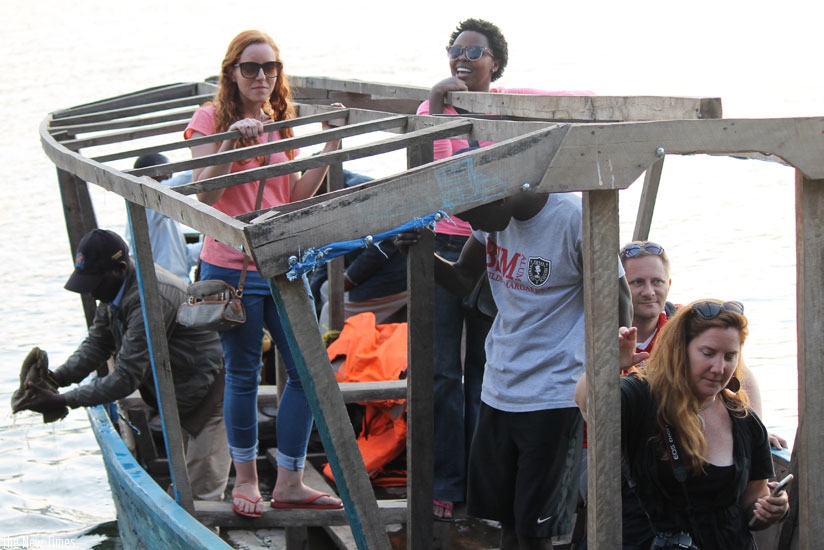 Tourists enjoy the thrill of the boat ride. (Moses Opobo)