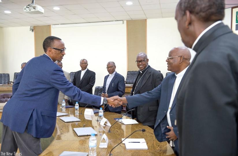 President Kagame greets Thadee Ntihinyurwa, the Archbishop of Kigali, while receiving the delegation of the Episcopal Council of Rwanda at Village Urugwiro over the weekend. (Village Urugwiro)
