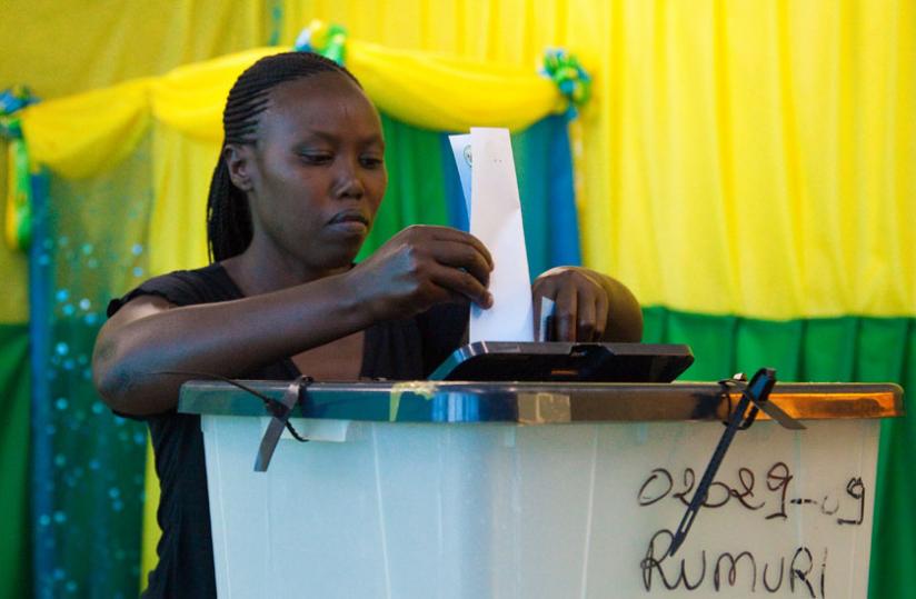 A citizen casts a ballot  at a polling station in Kiyovu in 2013. (File)
