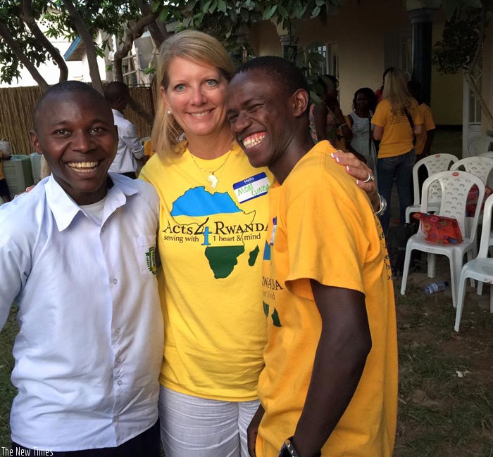 Mama Lynda (L) with happy beneficiaries. Her organisation currently supports over 40 needy children, mainly picked from the street. (Courtesy)
