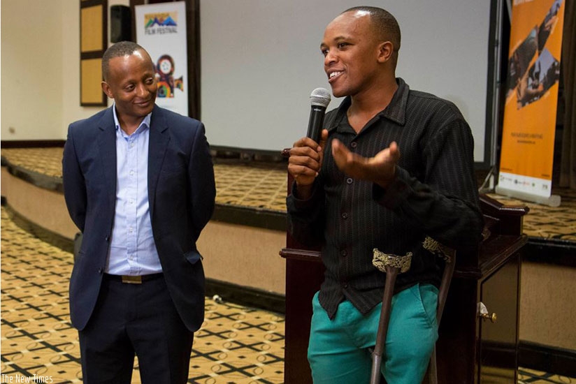 Rwanda Film Festival chairperson, Eric Kabera, with the inspirational star of one of the opening night short films, Rayisi (Photos by RFF)