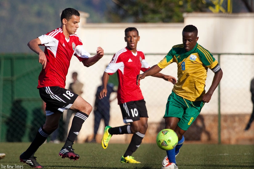 Captain Haruna Niyonzima in action as Amavubi beat Libya 3-0 in the 2015 Africa Cup of Nations encounter in Kigali last year. (Timothy Kisambira)