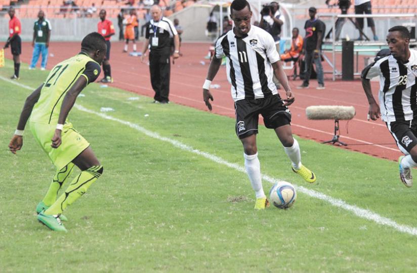 Left winger Patrick Sibomana in action against Burundi's Lydia Ludic in a Group B tie last week. (Courtesy)