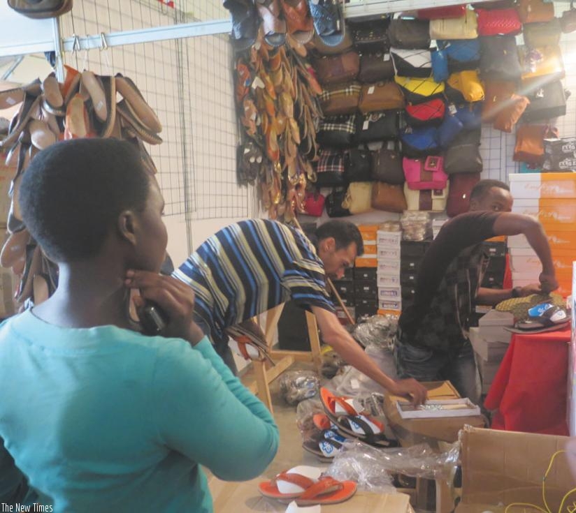 An exhibitor displays products at the Egyptian stand. (P. Tumwebaze)