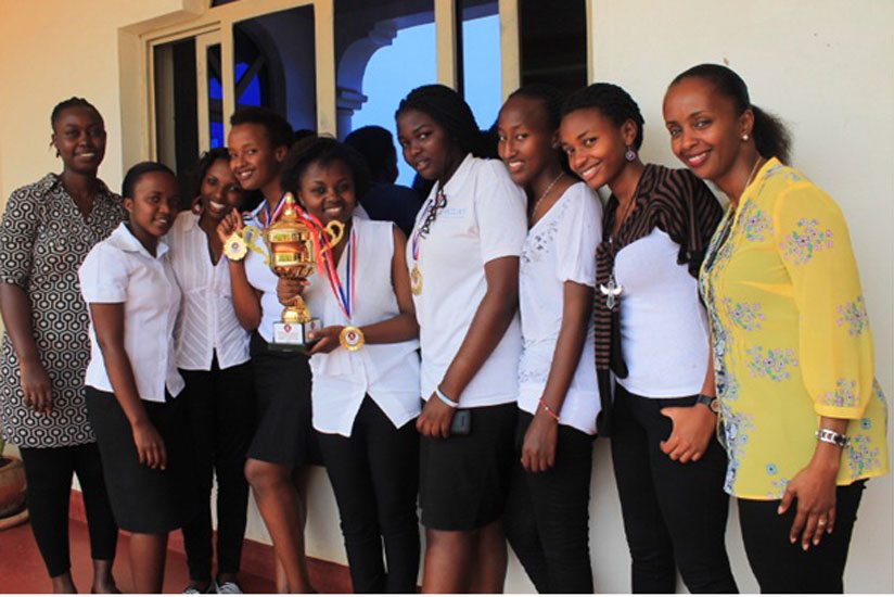 Akilah debate club members in a photo with the Country Director (extreme right) and the Debate club coordinator. The club won the 2015 inter-university debate in Kigali in June. (Courtesy)