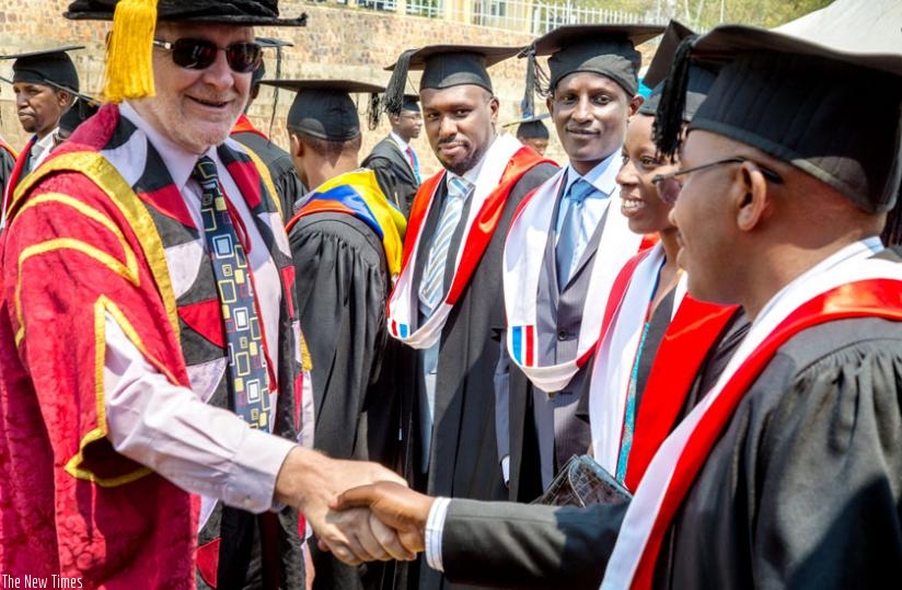 Prof. James McWha, the vice-chancellor of the University of Rwanda, congratulates Masters graduands of the College of Science and Technology during the varsity's second graduation ceremony yesterday. (Doreen Umutesi)
