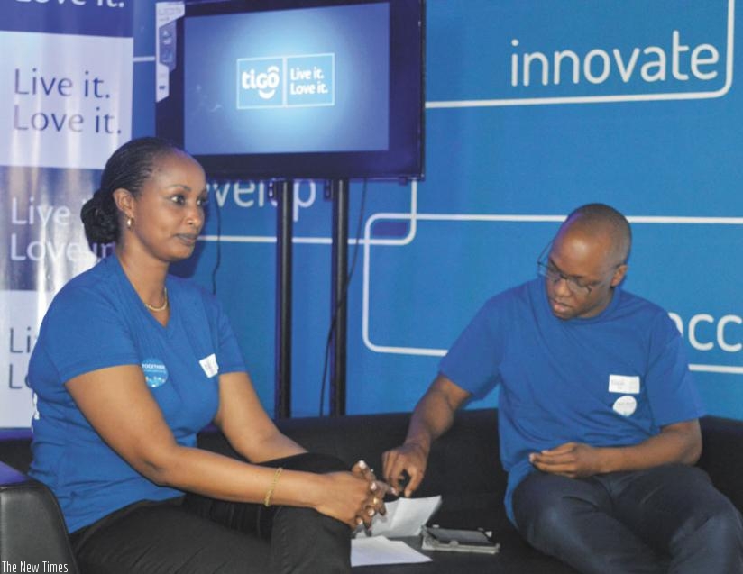 Maramba (right) and Tigo deputy CEO, Chantal Umutoni Kagame, at the launch of the new Tigo slogan 'Live it. Love it'. (Geoffrey Wakibi)