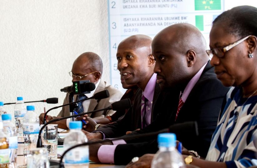 Harerimana (2nd left), Nduhungirehe (C) and  Dr Alivera Mukabaramba, head of Party for Progress and Concord, during the meeting yesterday. (Timothy Kisambira)