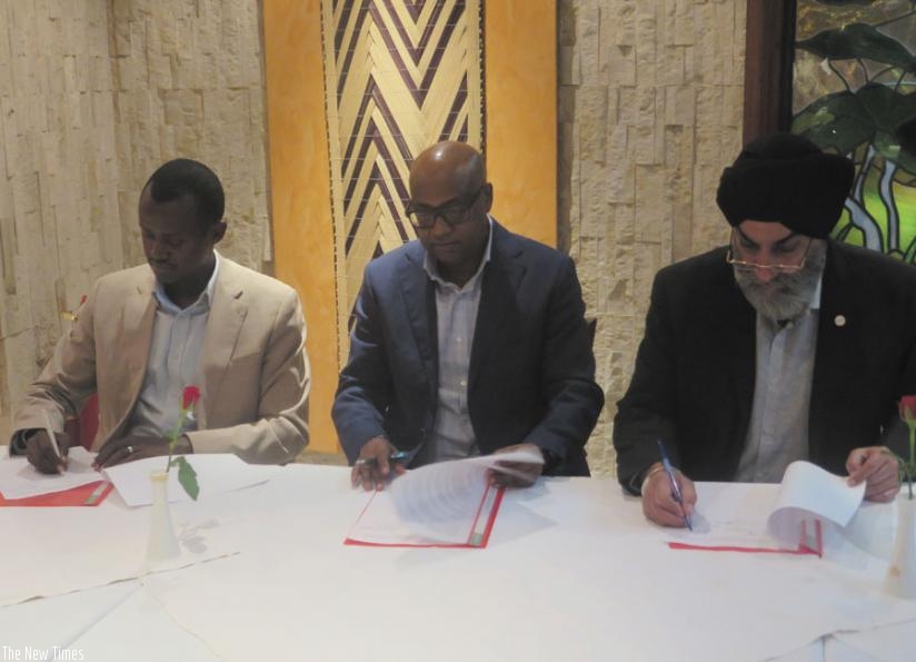 L-R: RDB's Karasira, Birori and Sahni sign the memorandum of understanding on Wednesday in Kigali. The deal is expected to help the marketing of Rwanda in India. (Michel Nkurunziza)