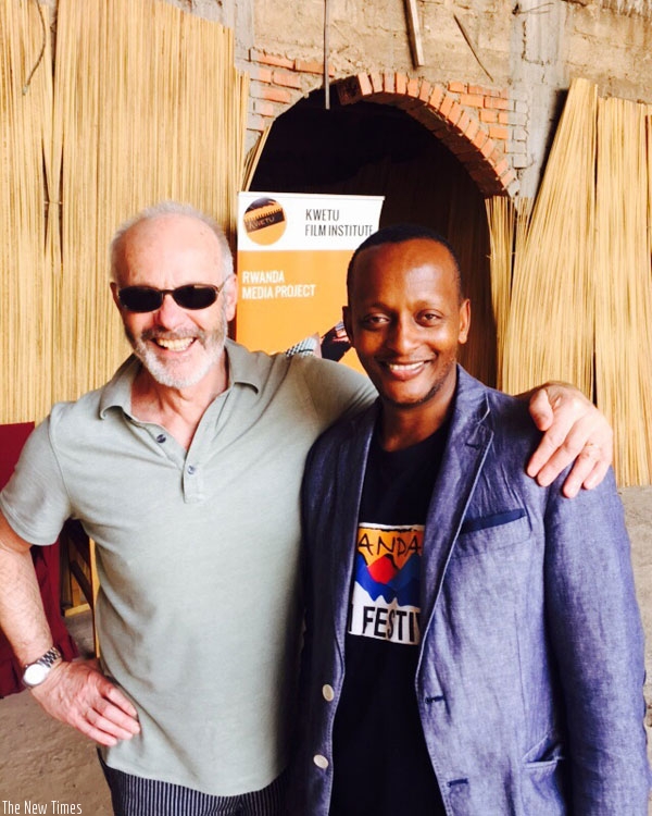 English movie director and screenwriter Michael Radford (L) poses with Rwanda Film Festival chairperson, Eric Kabera. (Courtesy)