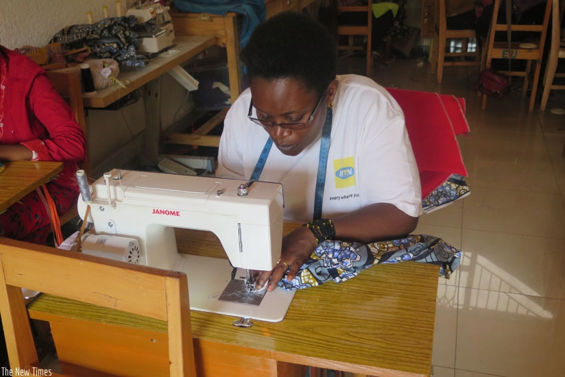 One of the women at Nyamirambo Women Center sewing. (Solomon Asaba)