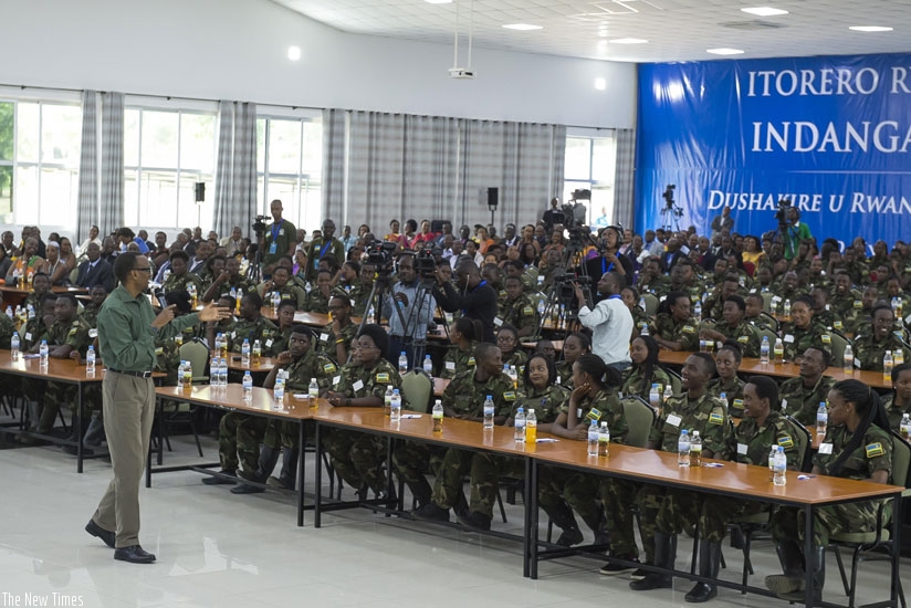 President Kagame talks to Rwandan youth during the closure of a three-week Itorero (civic education course) at Gabiro School of Infantry yesterday.The Head of State told the youth that they should take responsibility to build their country by using skills they have acquired abroad. (Village Urugwiro)