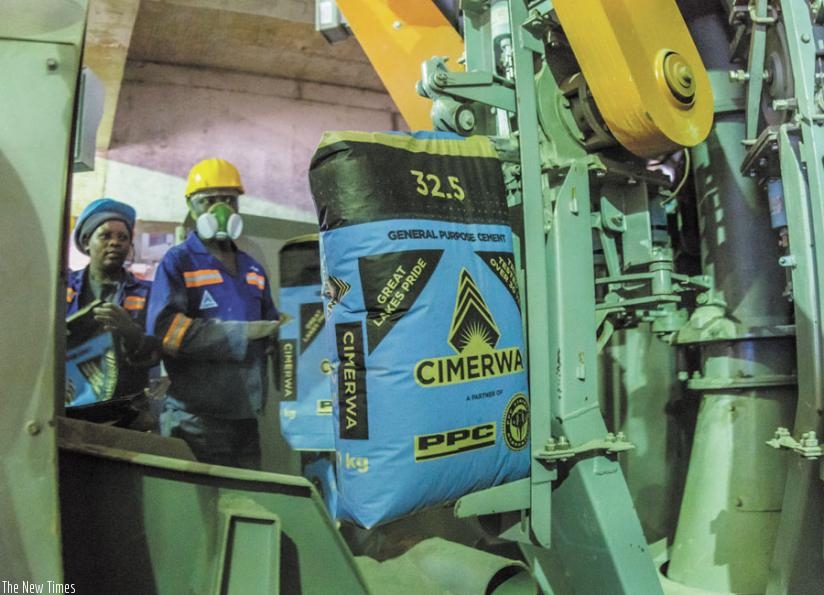 Cimerwa workers monitor a cement production line. Manufacturers in the EAC say lack of key skilled personel is costing them millions in imported labour. (Timothy Kisambira)