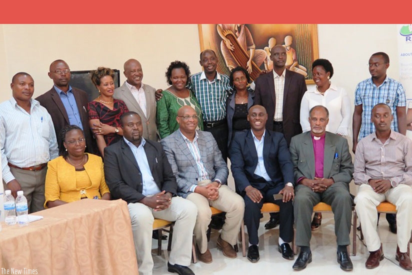 The new committee members (back row) pose for a photo with the Rwanda Mining Association officials and Gerard Mukubu, PSF vice president (3rd R  - front row) and Kayihura (2nd L - front row) on Friday. (E.  Ntirenganya)