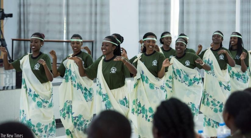Some of the Rwandan Diaspora students who completed a civic education training programme, at Gabiro over the weekend, display Amaraba traditional dance skills. (Courtesy)