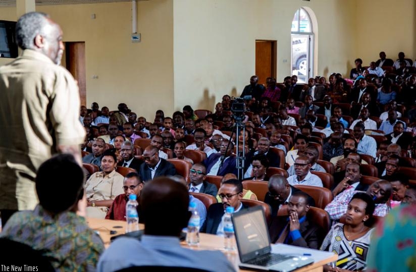 Senator Rutaremara (L) addresses lawyers, researchers and religious leaders in Kigali on Monday. (Timothy Kisambira)