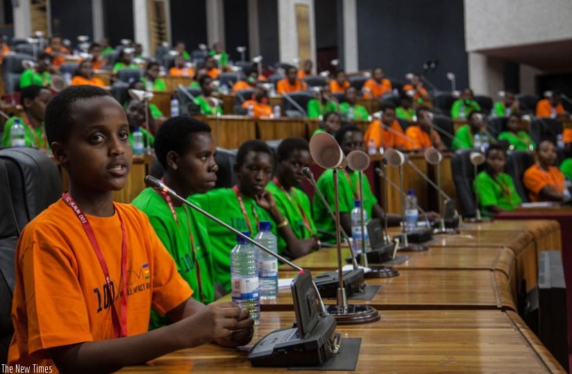 Participants in the plenary chamber learn about the role of Members of Parliament. (Faustin Niyigena)
