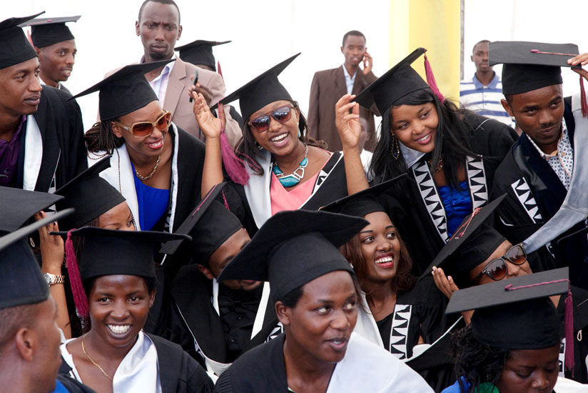 Graduates of the College of Science and Technology share a light moment at a graduation ceremony last year. (File)