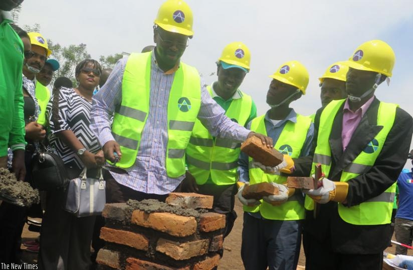 Infrastructure minister James Musoni lays a foundation stone for construction of a water treatment plant in Nyagatare on Saturday. (Theogene Nsengimana)
