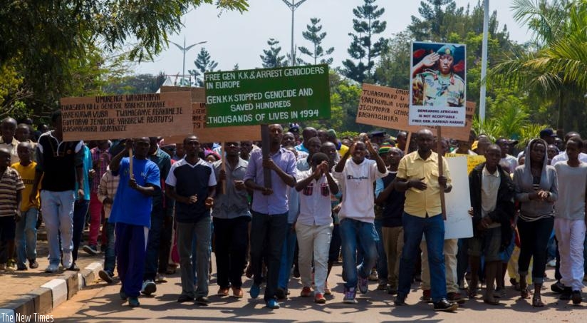 Demonstrators march to the British High Commission in Kigali to protest the arrest of Gen Karake in June. (Doreen Umutesi)