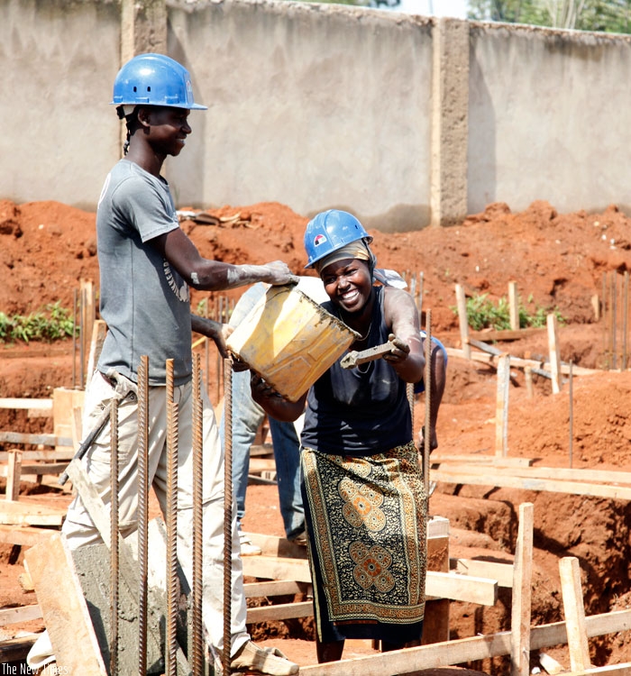 A male and female workers at a construction site in Kigali. (File)